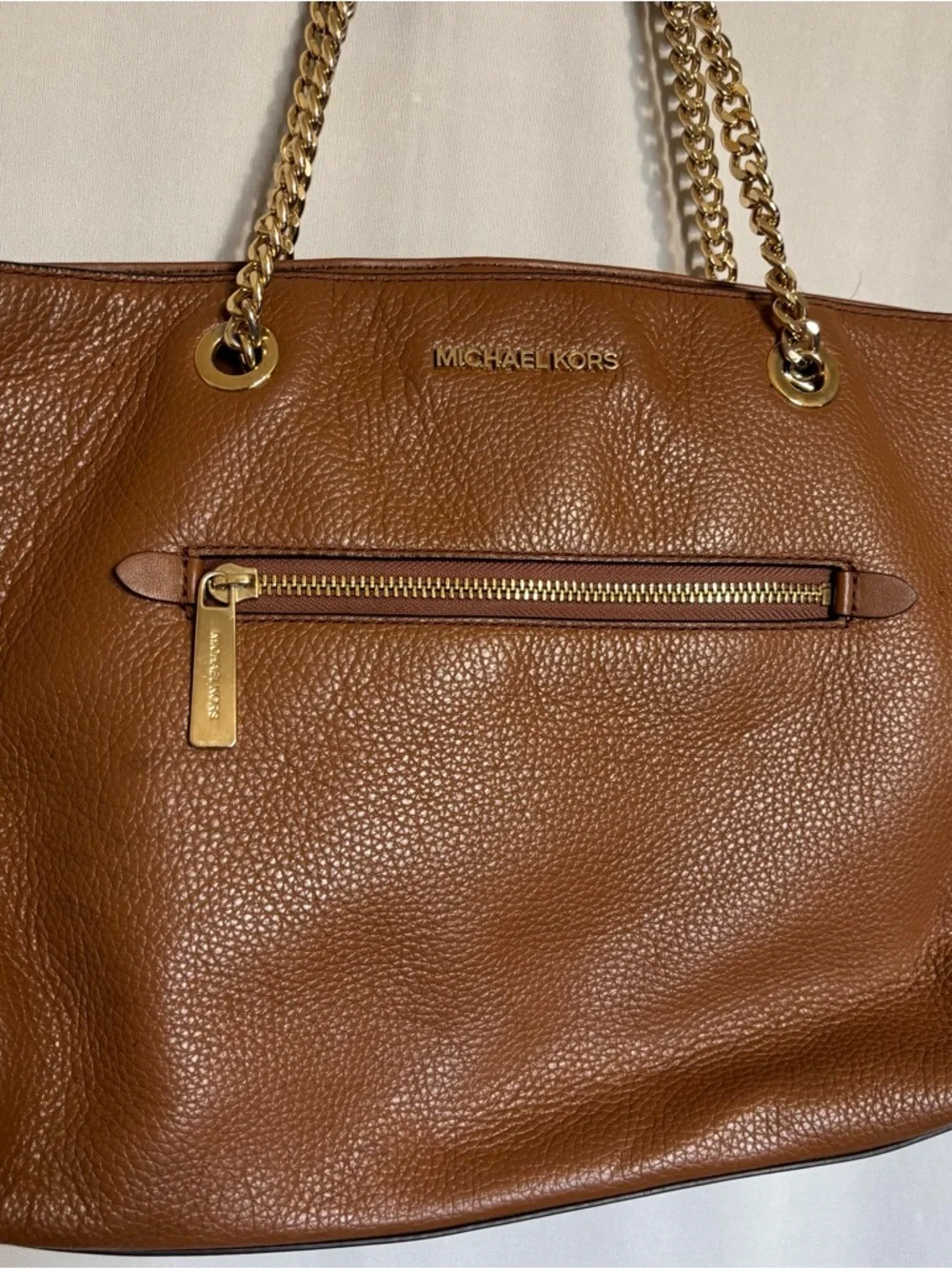 Michael Kors Cognac Pebbled Leather Tote with Gold Chain Straps zipper closure